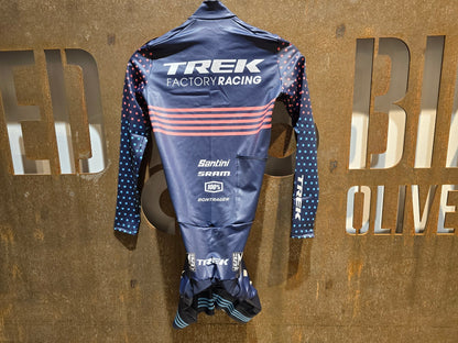 Damenbekleidung - TFR von Santini, TREK FACTORY RACING CX / CX SUIT LONGSLEEVE W. PKT / EINTEILER / DAMEN in variant_title vor USEDBIKES - OB.DE Hintergrund