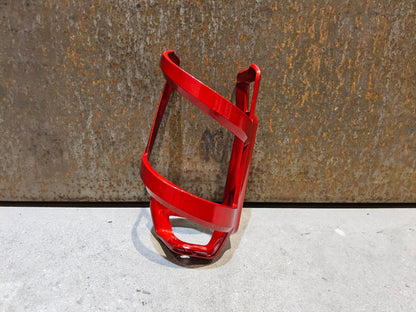 Trinkflaschen und Halter von Trek, TREK LEFT SIDE LOAD RECYCLED FLASCHENHALTER / CRIMSON vor USEDBIKES - OB.DE Hintergrund