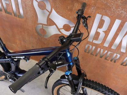 E - Mountainbike von Trek, TREK POWERFLY+ FS 8 GEN 4 / MATTE/GLOSS MULSANNE BLUE / L vor USEDBIKES - OB.DE Hintergrund