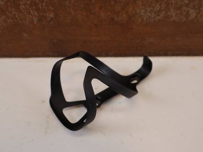 Trinkflaschen und Halter von Trek, TREK PRO CARBON FLASCHENHALTER / SCHWARZ MATT vor USEDBIKES-OB.DE Hintergrund