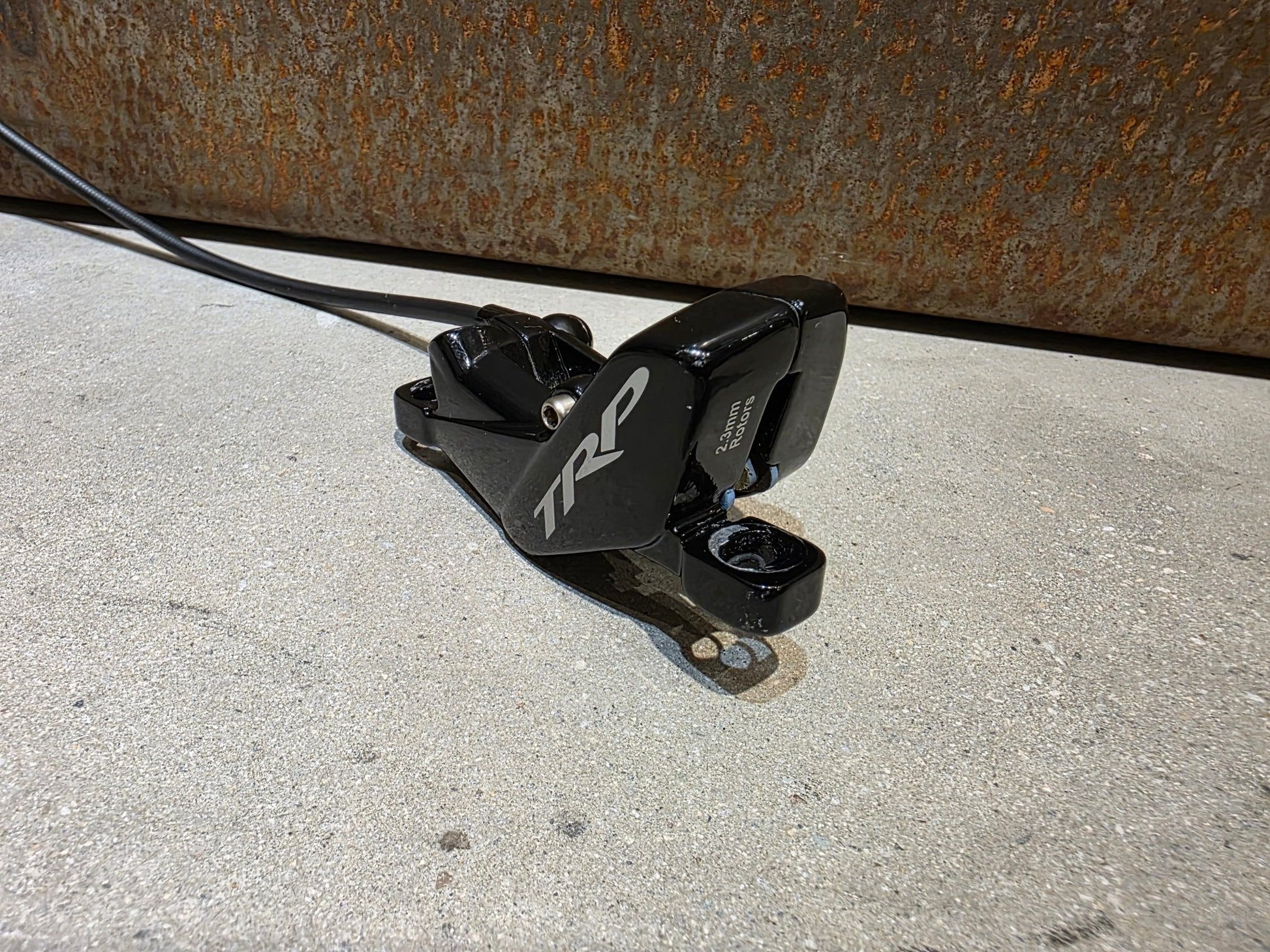 Bremse von TRP, TRP TRAIL EVO HD - M843 SCHEIBENBREMSE 203MM VORNE UND HINTEN vor USEDBIKES - OB.DE Hintergrund