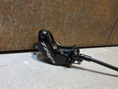 Bremse von TRP, TRP TRAIL EVO HD - M843 SCHEIBENBREMSE 203MM VORNE UND HINTEN vor USEDBIKES - OB.DE Hintergrund