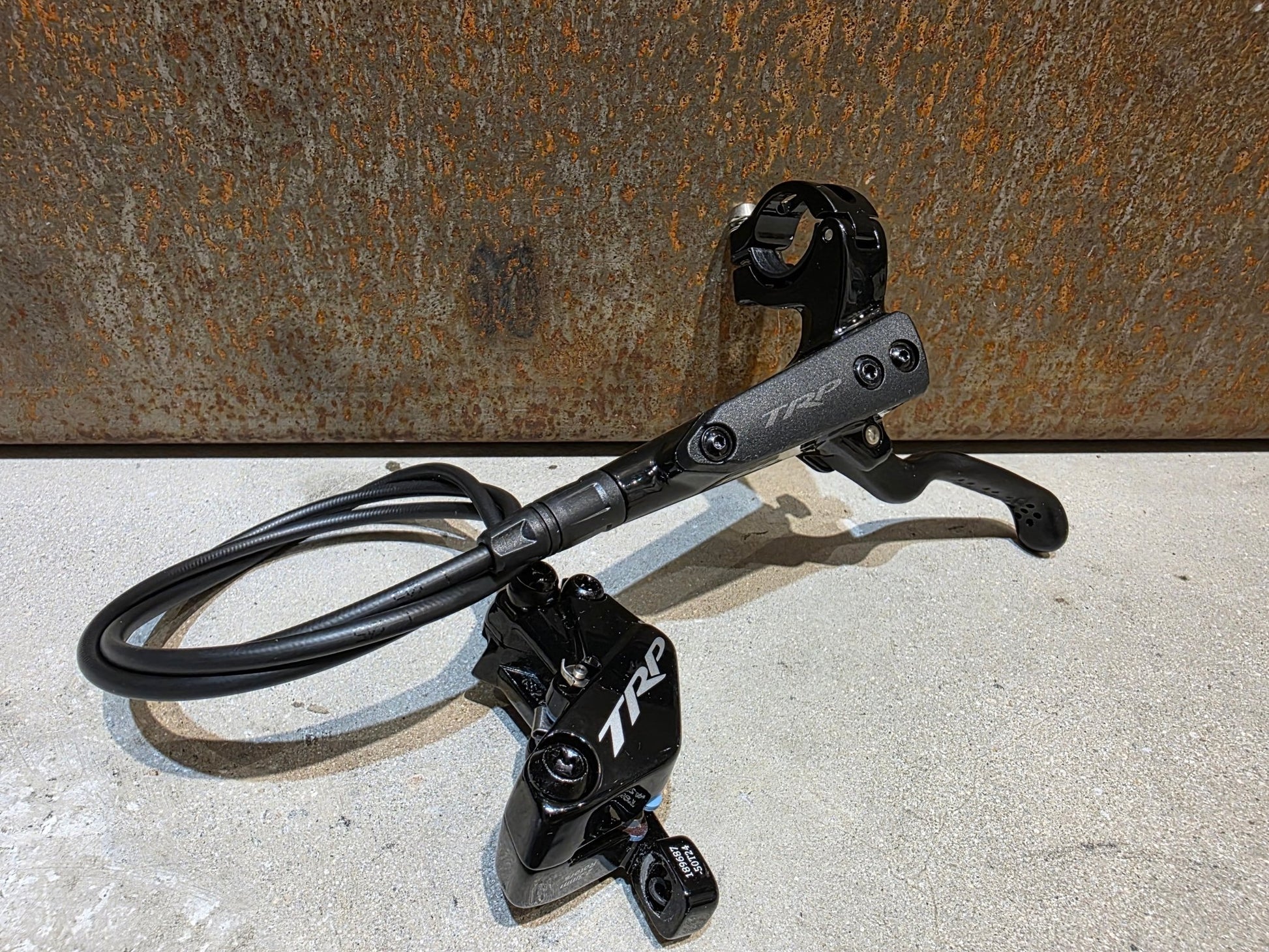 Bremse von TRP, TRP TRAIL EVO HD - M843 SCHEIBENBREMSE 203MM VORNE UND HINTEN vor USEDBIKES - OB.DE Hintergrund